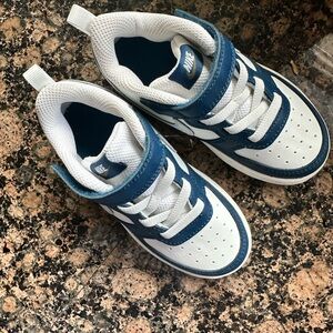 Brand new Nikes that my son outgrew before we remembered we had them. 🙃